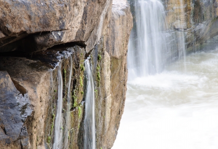 Little waterfall form the rock of cliff の写真素材