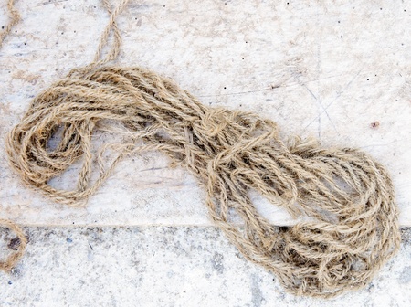 Old hemp rope on the ground of house の写真素材