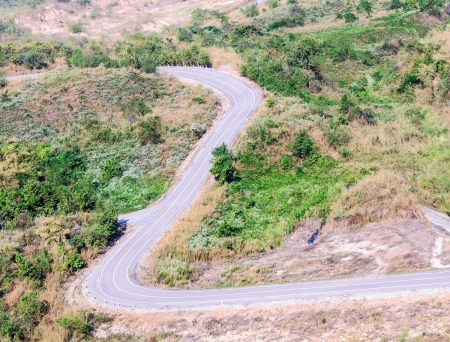 Curve street on the mountain and go straight to natural park の写真素材