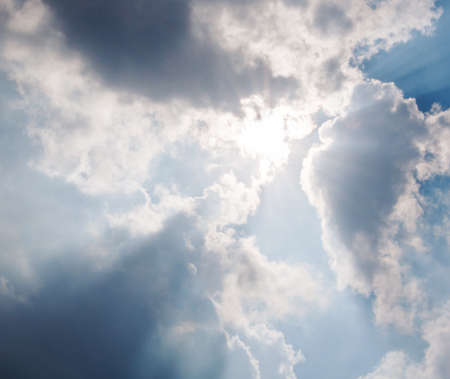 Sun light is through the rain cloud over the sea 