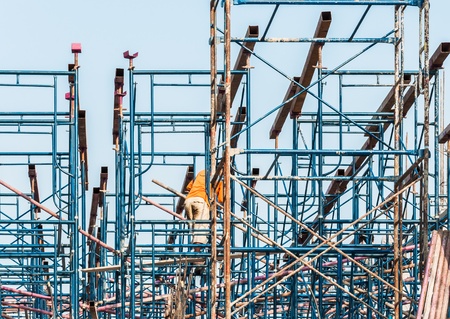 Blue metal scaffold on the construction building in Thai temple の写真素材