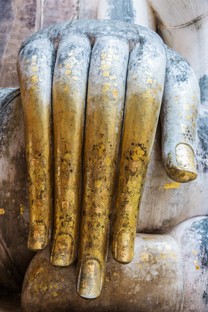 Large hand of white Buddha statue in Thailand の写真素材