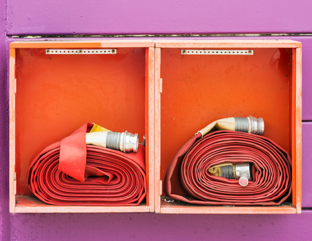 Double fire hose in the  box of gas station の写真素材