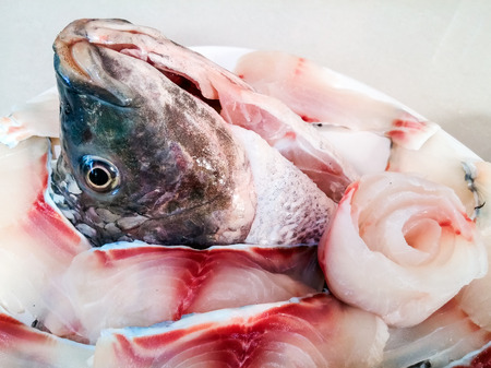 Tilapia fish head on the fish slice in Thai style.