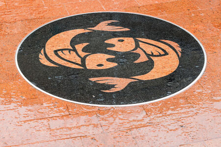 Pisces symbol on the plaza in Thai town.の写真素材