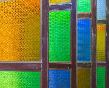 Colorful wooden window of the small church.の写真素材