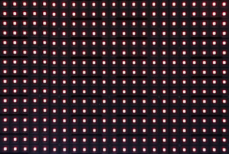 Red light dot from led screen in the advertising display.