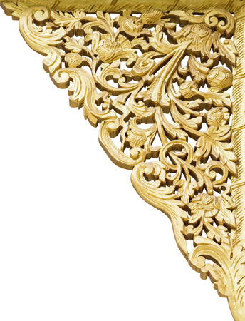 Golden flower carving on the white background.の写真素材