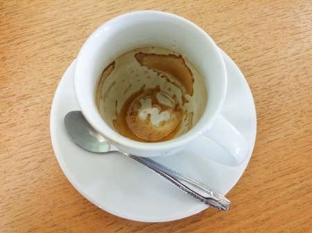 Empty coffee cup on the wooden table.の写真素材