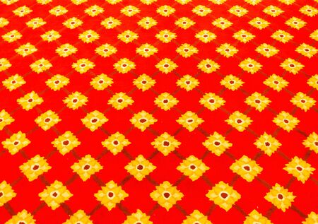 Red carpet with flower pattern in the church of Thai temple.の写真素材
