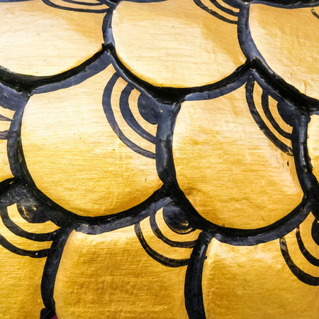 Golden scales of the dragon statue in Chinese style.の写真素材