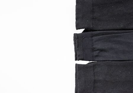 Group of black sock on the white background.の写真素材