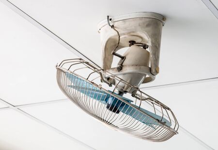 Dirty ceiling fan on the top of living room.