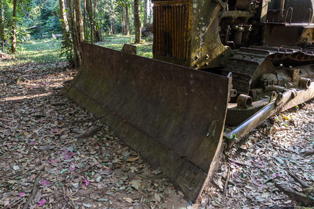 Old tractor is broken on the countryside farm.