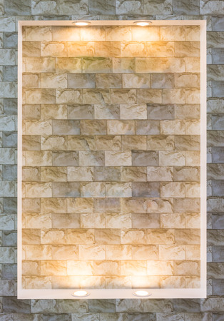 Modern brick wall with bulb light in the exhibition hall.の写真素材