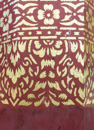 Golden flower paint in the traditonal Thail style on the pillar church.