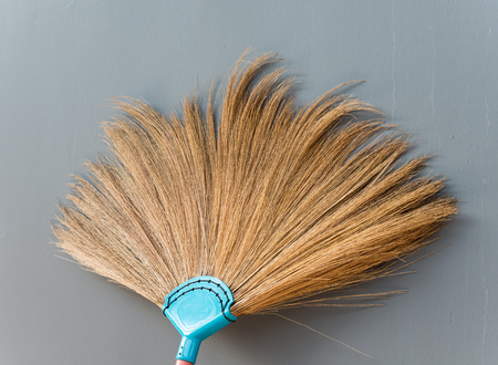 New broomstick is lying on the house wall.の写真素材