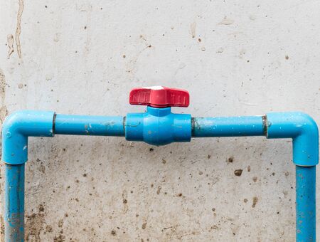 Red plastic valve for control the water flow of the water supply.の写真素材