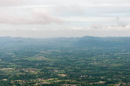 Birdeye view from the high mountain with light mist in the early moring.の写真素材