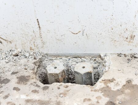 Hexagon concrete  pole in the concrete floor of the construction house.の写真素材