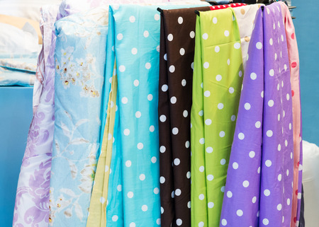 Bed sheet set is hanging in the bedding shop.