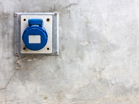 Main outlet port with the plastic cover on the cement wall of the factory,Copy space.の写真素材