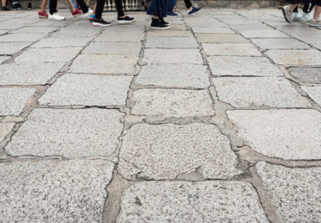 Stone tile path with the walker in the pedestrian way,grand palace Thailand.(Blur focus)の写真素材