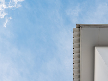 White ceiling outside the modern house under the roof tile with the clear blue sky,Copy space.の写真素材