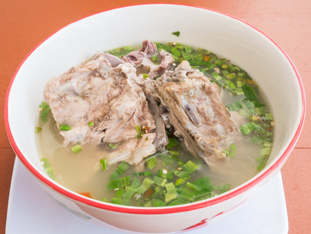 Boiled pork spine with the chilli and lime in the traditional Thai style.famous street food in Thailand.の写真素材