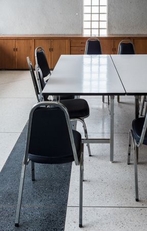 Large table and metal chair set for informal conference in the morning before the office hour outside the office building.の写真素材