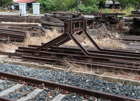 Steel buffers stop in the end of the railway at the junction of the local railway station.のeditorial素材