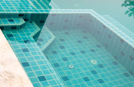 Staircase to the small pool before the large area of the swimming pool in the hotel.のeditorial素材