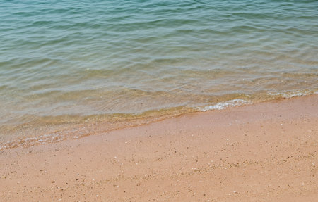 Transparent clear wave on the soft beach in the summertime, eastern coast of Thailand.の写真素材
