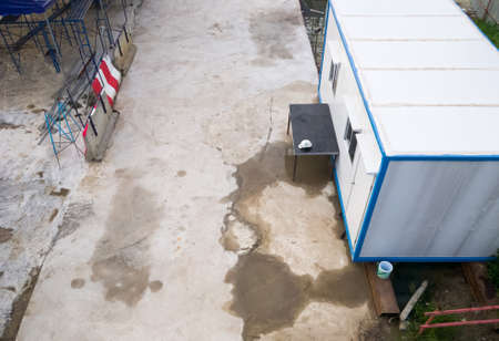 The temporary container box for use to the office room in the construction site, near the monorail...