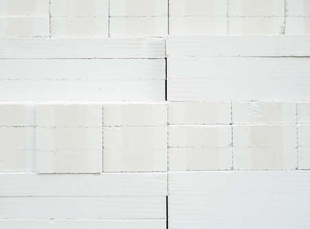 Closeup of the lightweight brick is stacking in the warehouse to sale in the urban area,  front view...