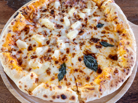 The margherita pizza served on the wooden pan from the homemade kitchen, overview with the copy space.の写真素材