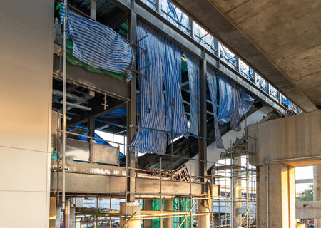 The escalators are being installed at the connection between the suburban train station and the...