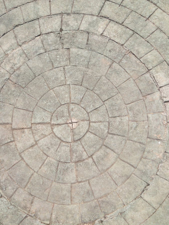 Paving block in the circle shape for the walking path in the public park, front view for the background.の写真素材
