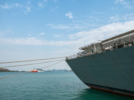 The rear side of the small aircraft carrier in the harbor for maintenance period, front view with the copy space.の写真素材