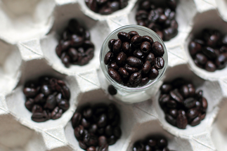 Coffee beans coffee cups filled with coffee beans