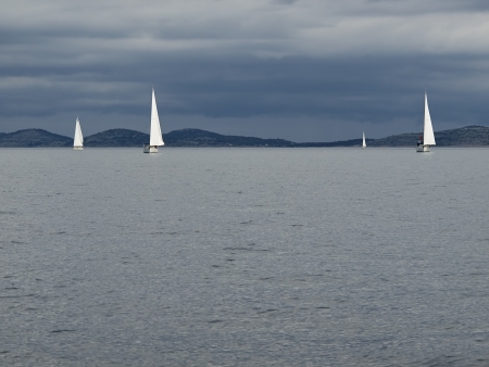 Last sailing boats on regatta      の写真素材