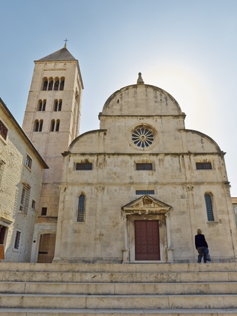 woman in front of church of St  Mary, Zadar, Croatia       の写真素材