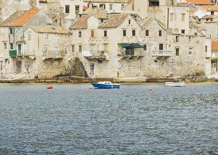 Part of the Komiza coastal town on the island of Vis in Croatiaの写真素材