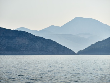 Coast between two islands in morning mist        の写真素材