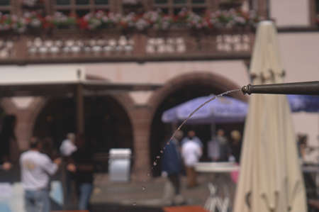 Water jet of a fountain dissolves into individual dropsの写真素材