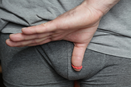 An abnormal tightness of the foreskin preventing retraction over the glans / Phimosis- theme interpretation Cの写真素材