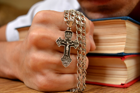 Orthodox cross in a strong handの写真素材
