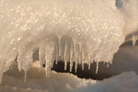 Icicles in winter on sunset light