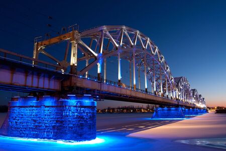 Railway bridge at night in winterの写真素材