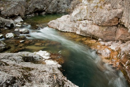 Waterfall with stones in wild natureの写真素材